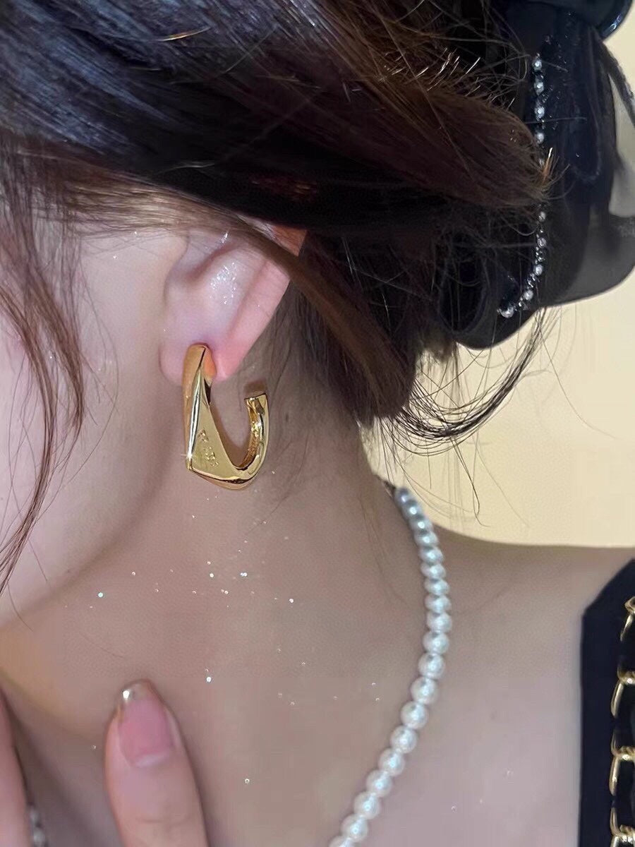 Prada Triangle Open 18K Gold Earrings product image 3, provided for visual reference and product detail review