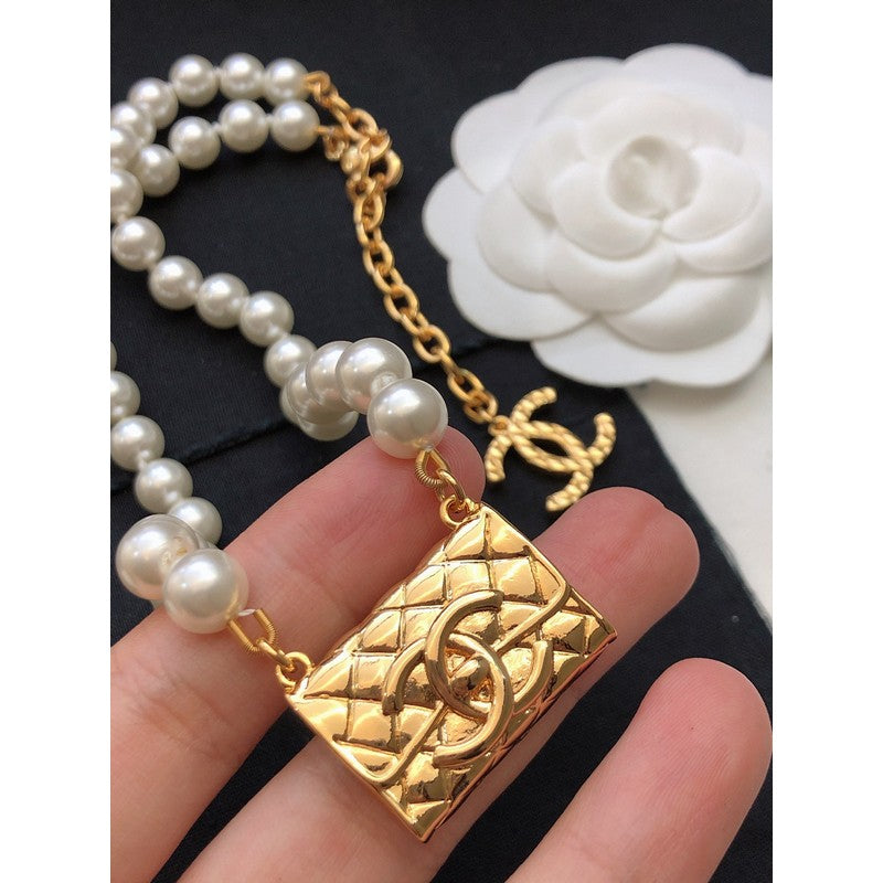 Chanel Pearl Bag Pendant 18K Gold Necklace product image 8, provided for visual reference and product detail review
