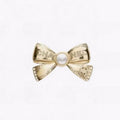 Chanel Bow Tie Gold 18K Gold Brooch product image 1, provided for visual reference and product detail review