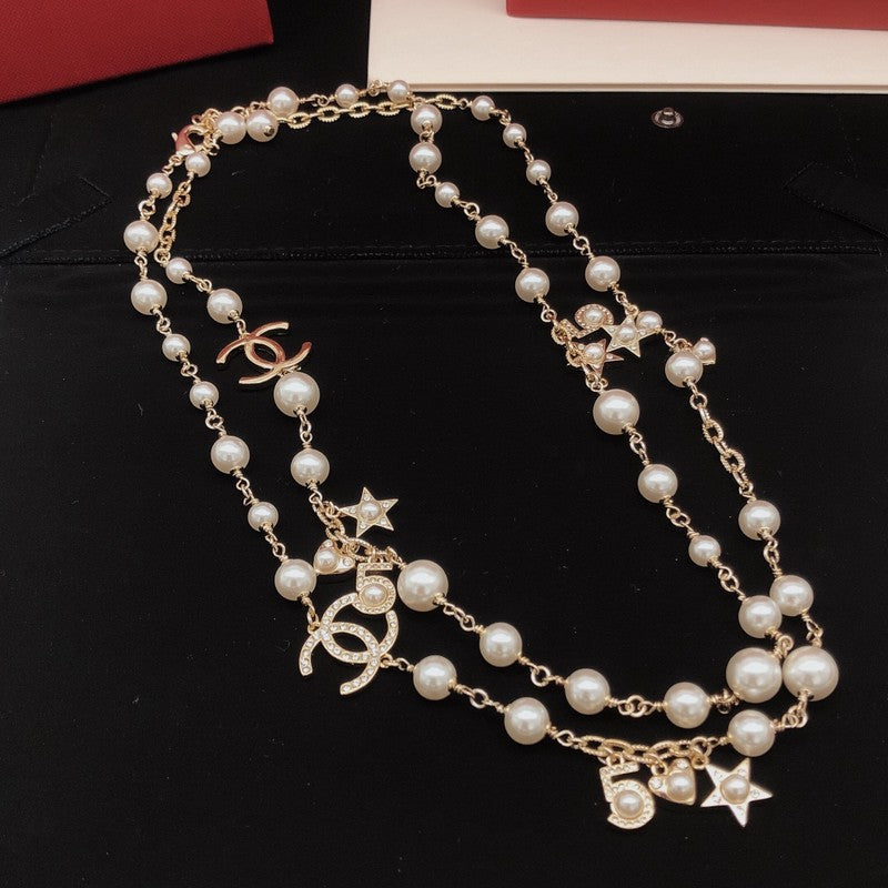 Chanel No.5 Star Long Pearl 18K Gold Necklace product image 2, provided for visual reference and product detail review
