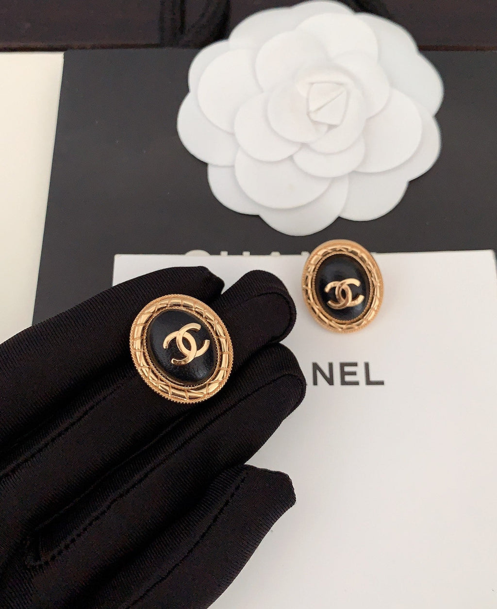 Chanel Oval Leather 18K Gold Earrings product image 5, provided for visual reference and product detail review
