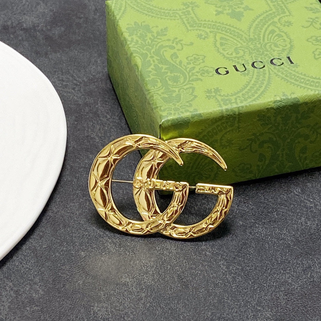 Gucci Double 18K Gold Brooch product image 1, provided for visual reference and product detail review