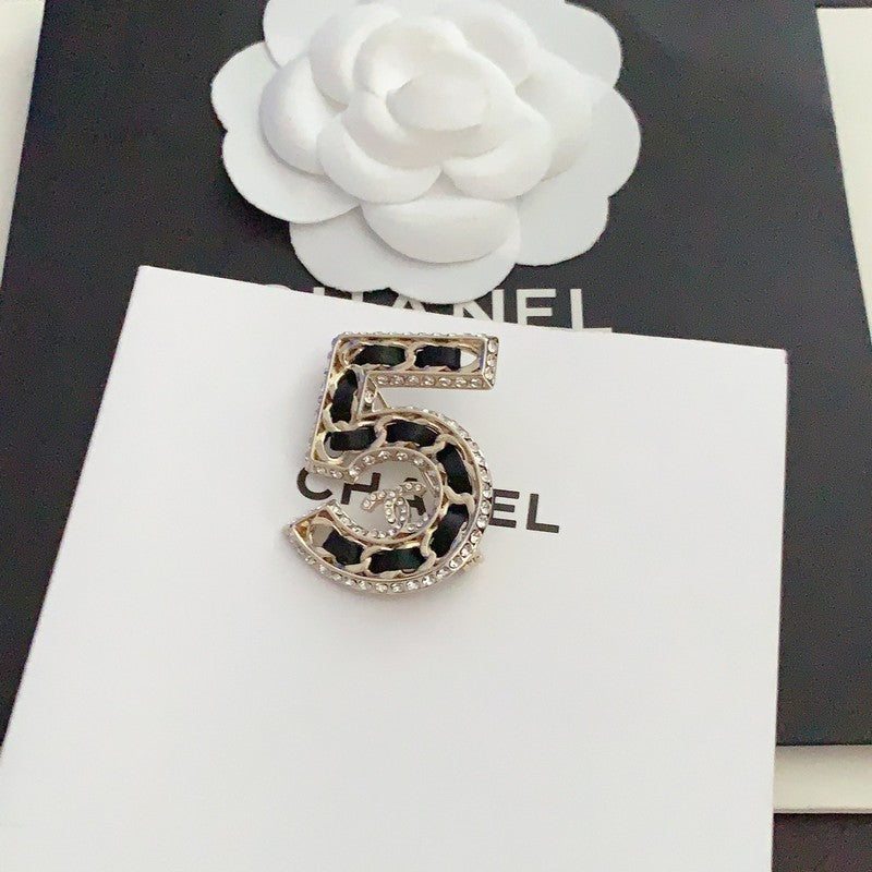 Chanel No.5 Leather Diamond 18K Gold Brooch product image 2, provided for visual reference and product detail review