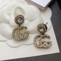 Gucci Double GucciCrystal Pendant 18K Gold Earrings product image 1, provided for visual reference and product detail review