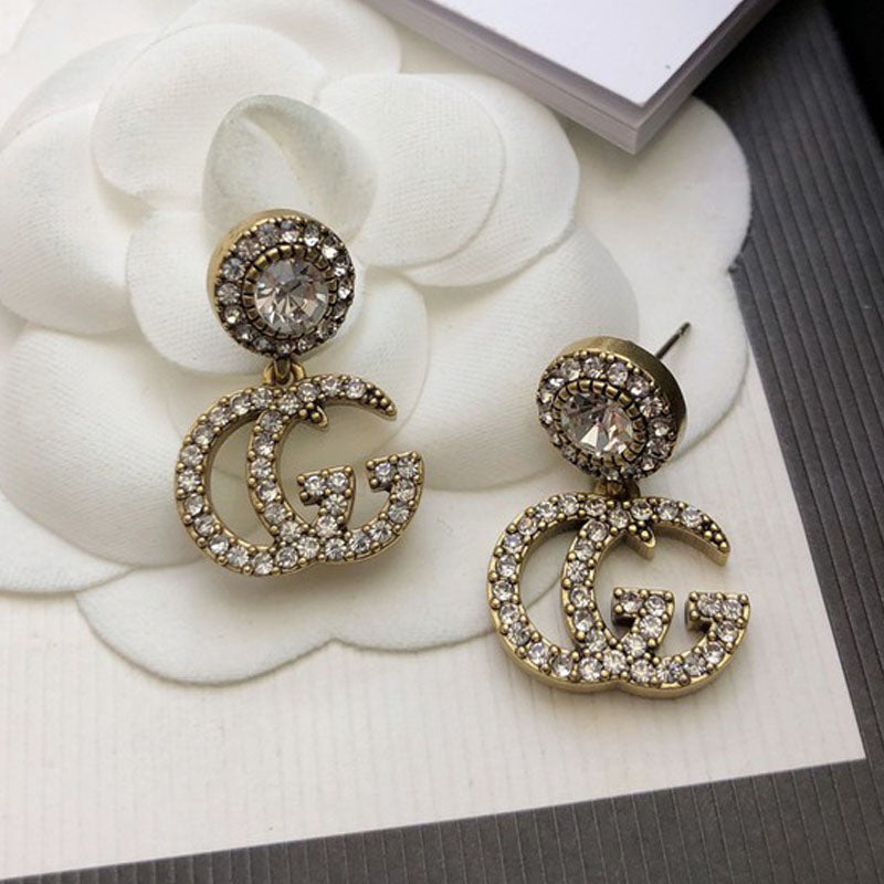 Gucci Double GucciCrystal Pendant 18K Gold Earrings product image 1, provided for visual reference and product detail review