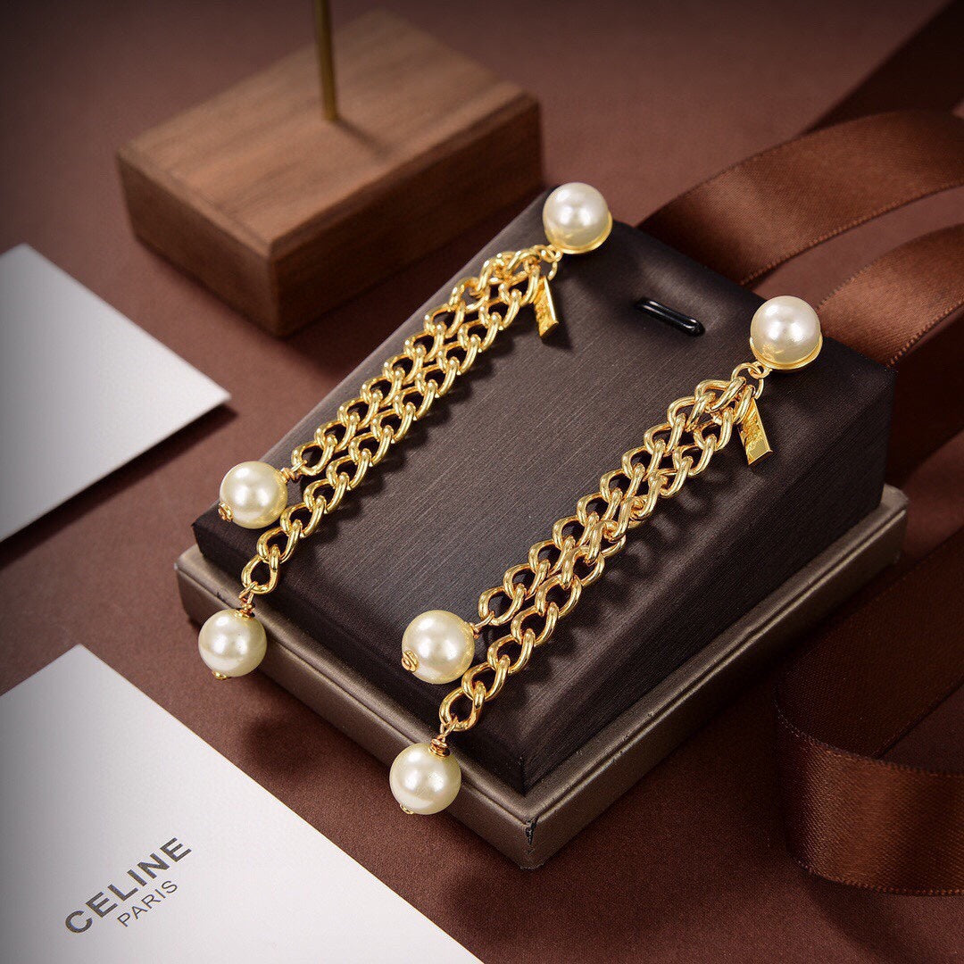 Celine Pearls Long 18K Gold Earrings product image 4, provided for visual reference and product detail review