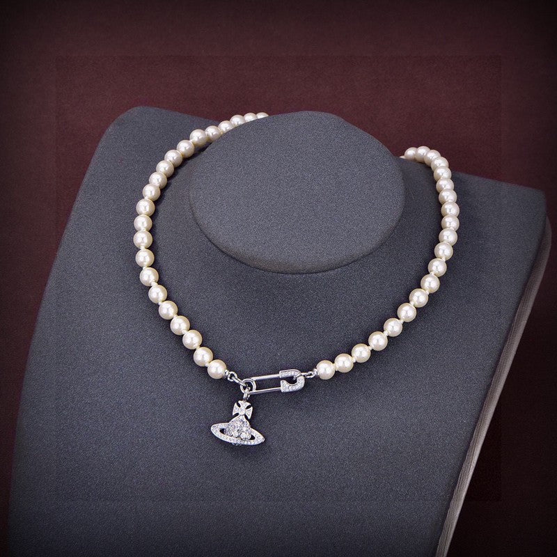 Vivienne West Mini Bas Relief Pearls 18K Gold Necklace product image 1, provided for visual reference and product detail