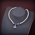 Vivienne West Mini Bas Relief Pearls 18K Gold Necklace product image 1, provided for visual reference and product detail