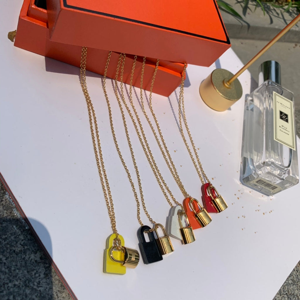 Hermes O'Kelly Orange Pendant 18K Gold Necklace product image 6, provided for visual reference and product detail review