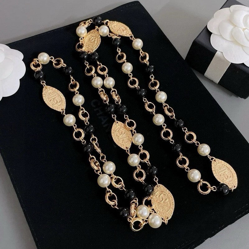 Chanel Long Black & White Pearls 18K Gold Necklace product image 1, provided for visual reference and product detail review