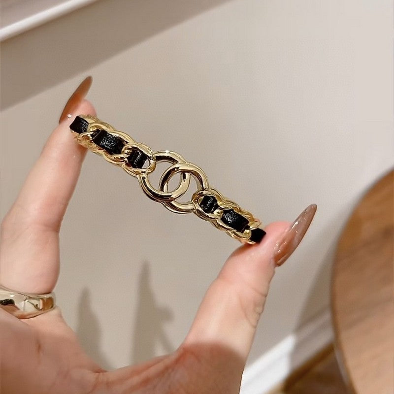 Chanel Black Leather Cuff 18K Gold Bracelet product image 5, provided for visual reference and product detail review