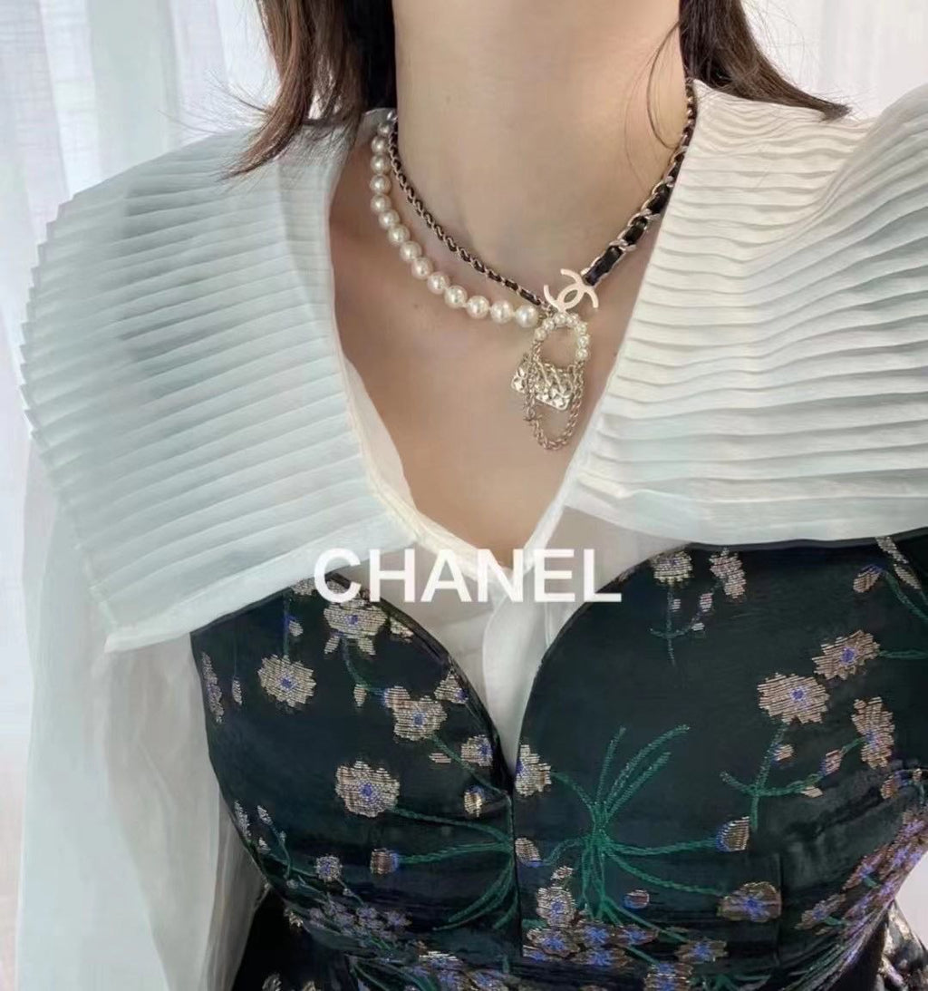 Chanel Pearl Leather Bag Pendant 18K Gold Necklace product image 2, provided for visual reference and product detail review