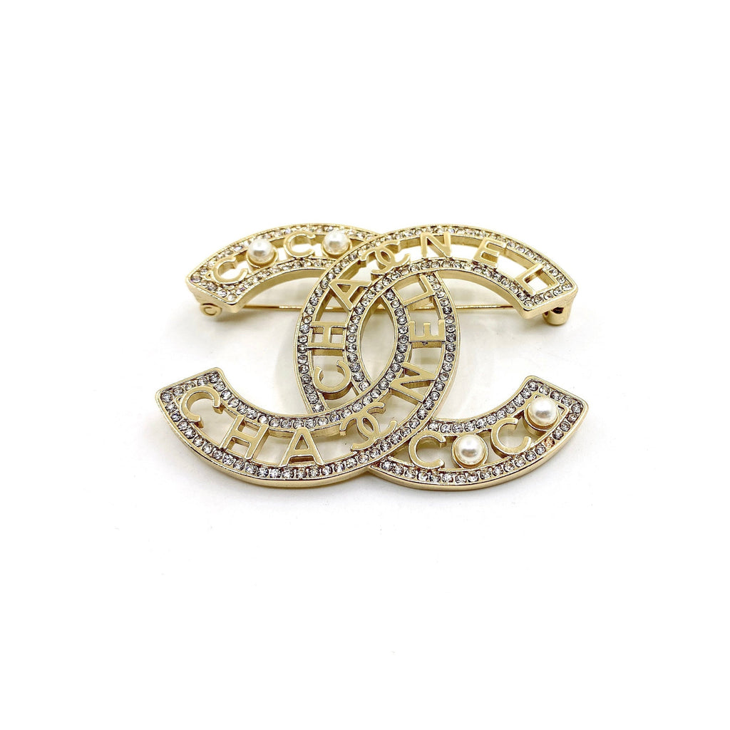 Chanel Script Diamonds 18K Gold Brooch product image 1, provided for visual reference and product detail review