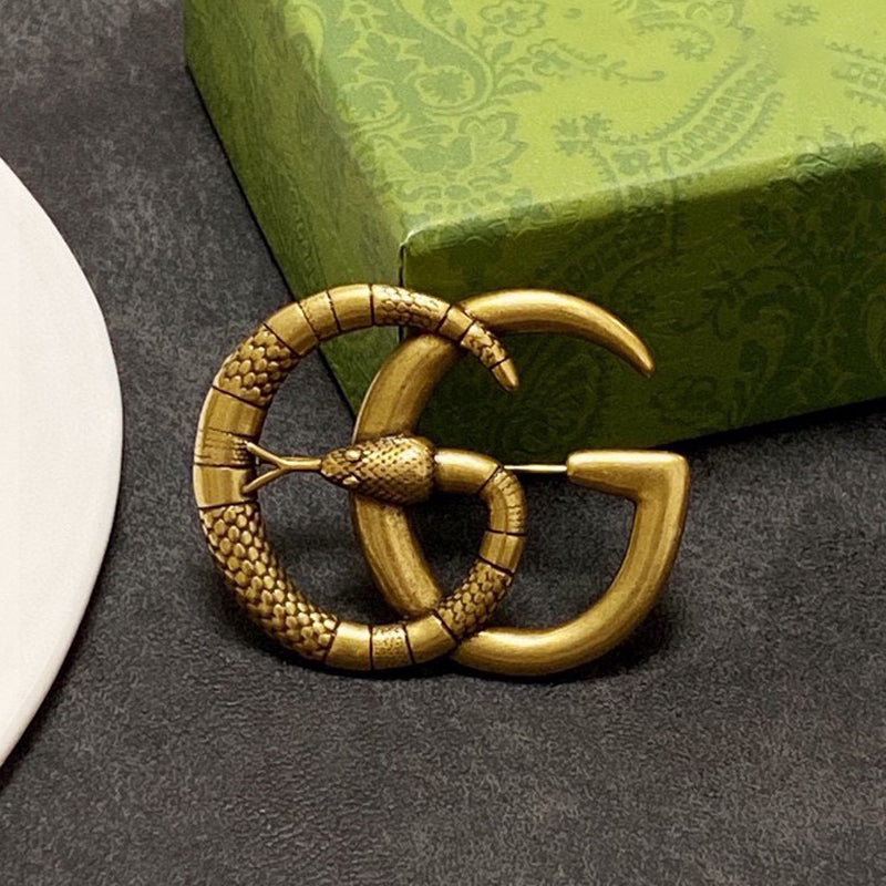 Gucci Double Snake 18K Gold Brooch product image 1, provided for visual reference and product detail review
