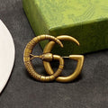 Gucci Double Snake 18K Gold Brooch product image 1, provided for visual reference and product detail review