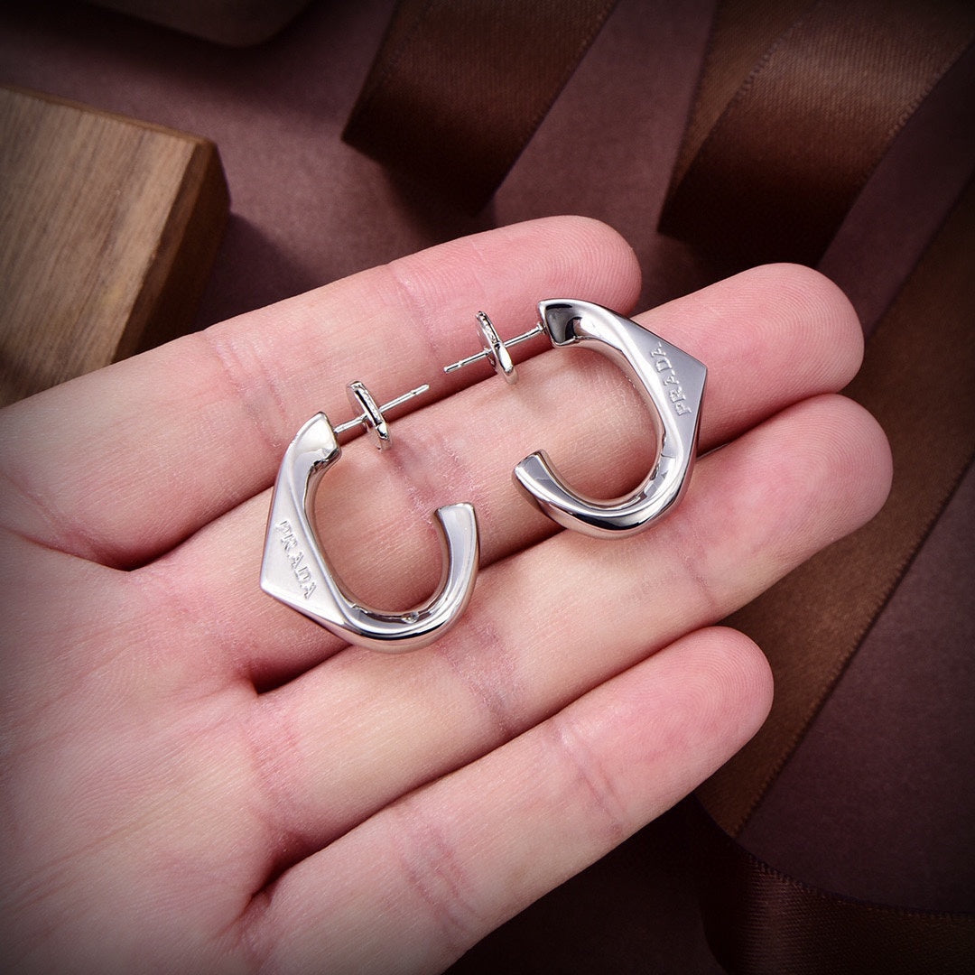 Prada Triangle Open 18K Gold Earrings product image 4, provided for visual reference and product detail review