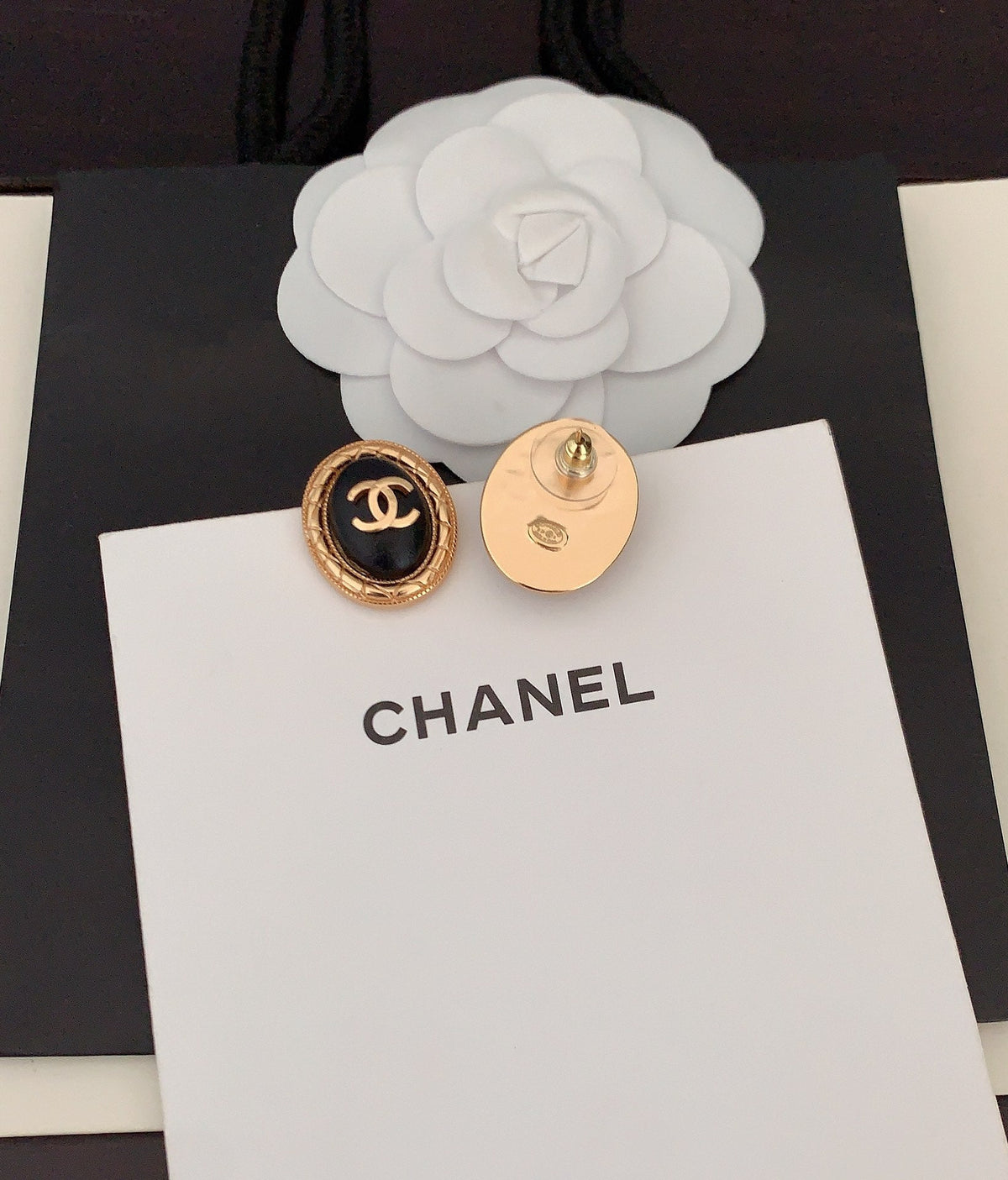 Chanel Oval Leather 18K Gold Earrings product image 6, provided for visual reference and product detail review