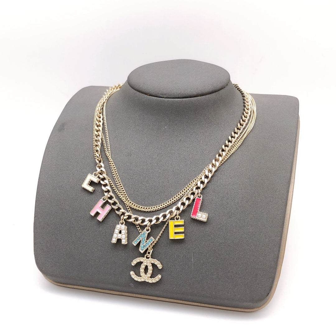 Chanel Color Typo 18K Gold Necklace product image 1, provided for visual reference and product detail review