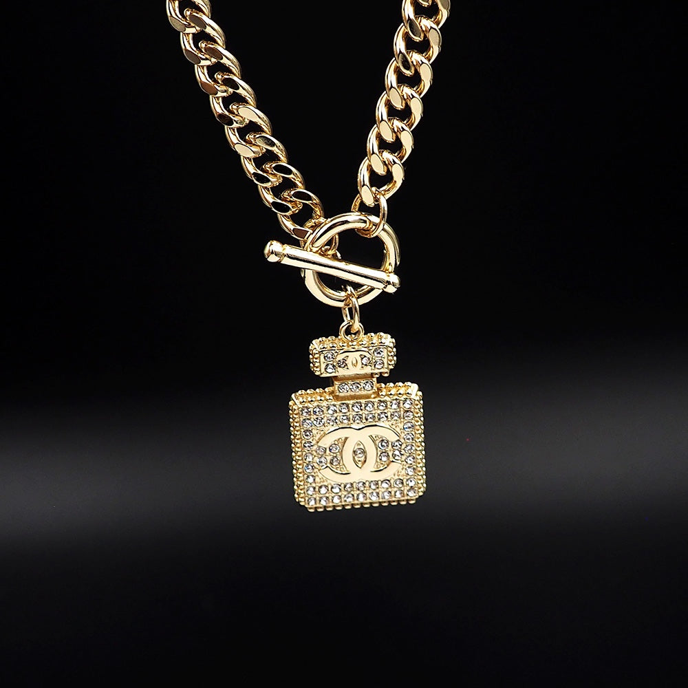 Chanel Diamond Perfume Bottle Pendant 18K Gold Necklace product image 9, provided for visual reference and product detail