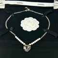 Chanel Pink & Black Heart Pearl 18K Gold Necklace product image 1, provided for visual reference and product detail review